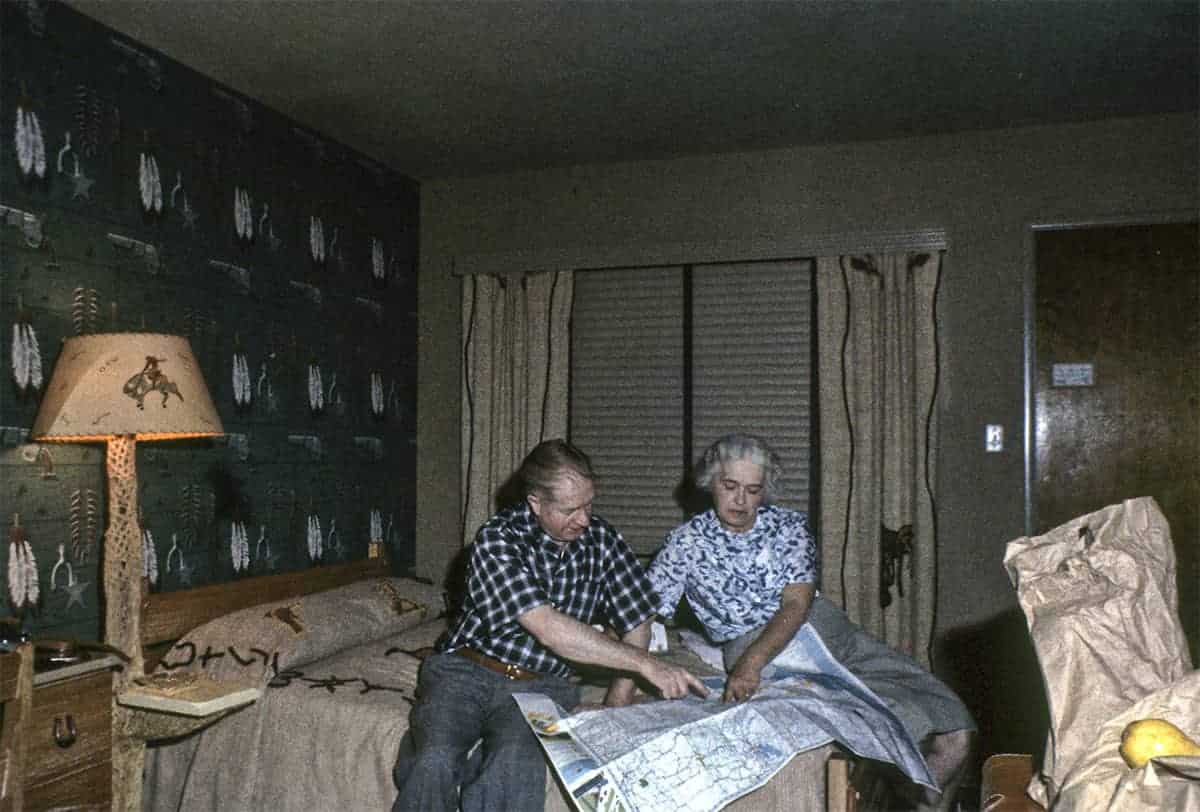 Using a paper map in a hotel room in the 70s.