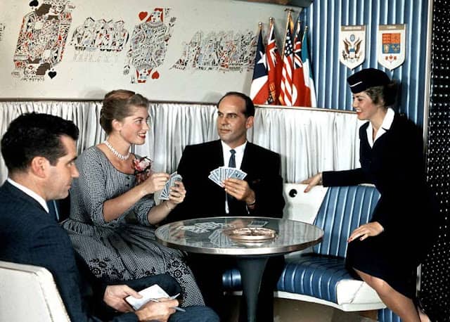 Playing cards in a airplane lounge during the golden age of air travel